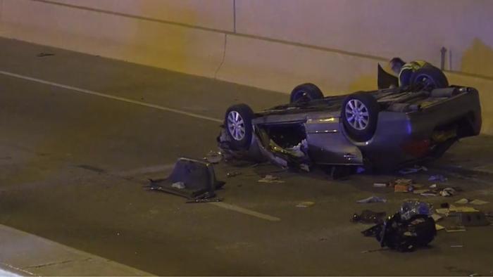Woman dies after vehicle drives off roadway, falls onto lower level of I-35 near downtown
