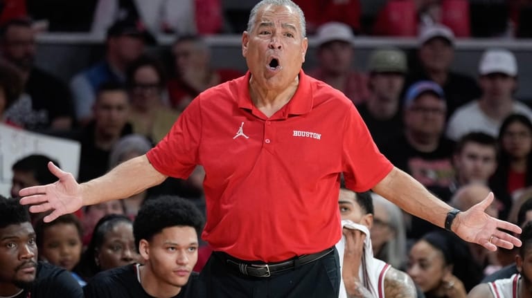 Houston head coach Kelvin Sampson argues a call during the...