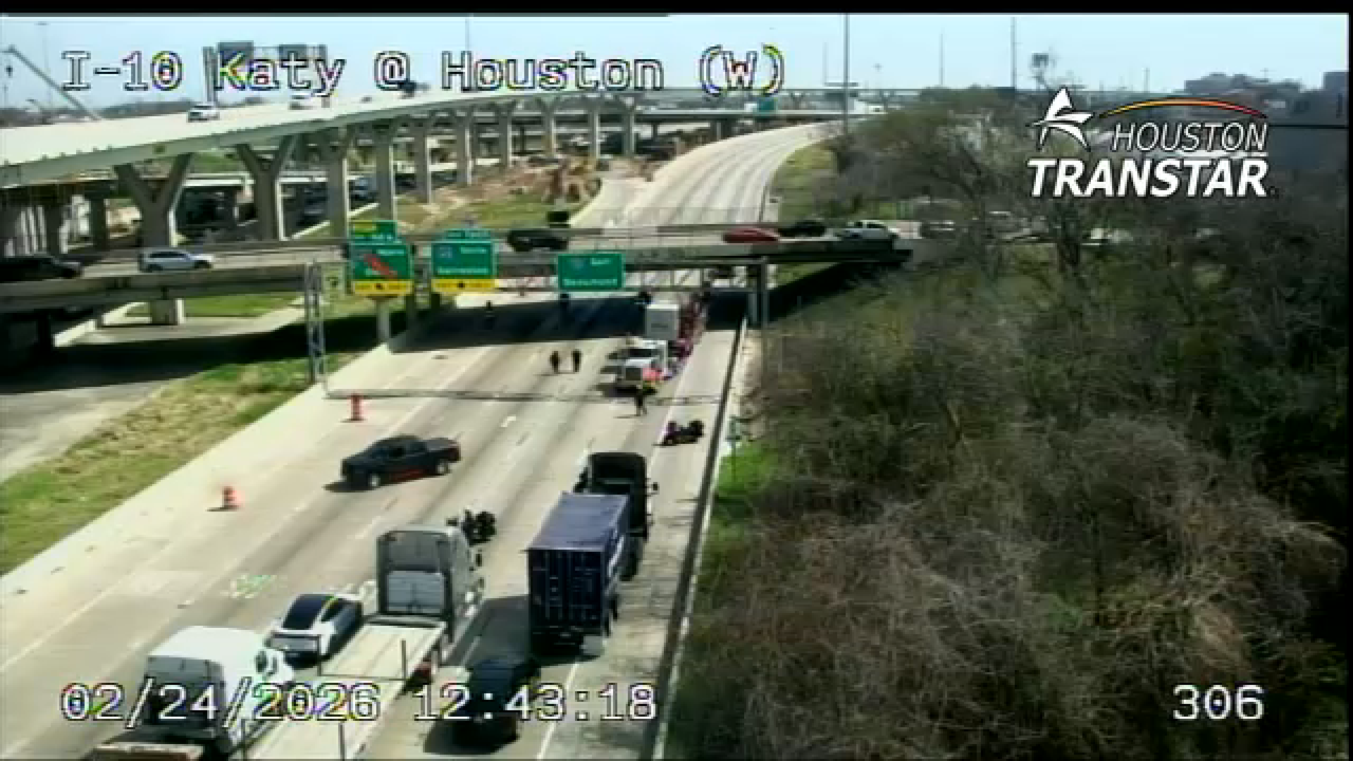 Cameras show officers escorting the 18-wheeler in the wrong direction on the freeway, with police stopping traffic going eastbound.