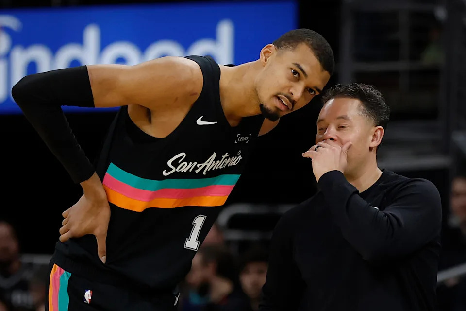 SAN ANTONIO, TX -FEBRUARY 21: Victor Wembanyama #1 of the San Antonio Spurs donors with head coach Mitch Johnson in the first half at Moody Center on February 21, 2026 in Austin, Texas. NOTE TO USER: User expressly acknowledges and agrees that, by downloading and or using this photograph, User is consenting to terms and conditions of the Getty Images License Agreement. (Photo by Ronald Cortes/Getty Images)