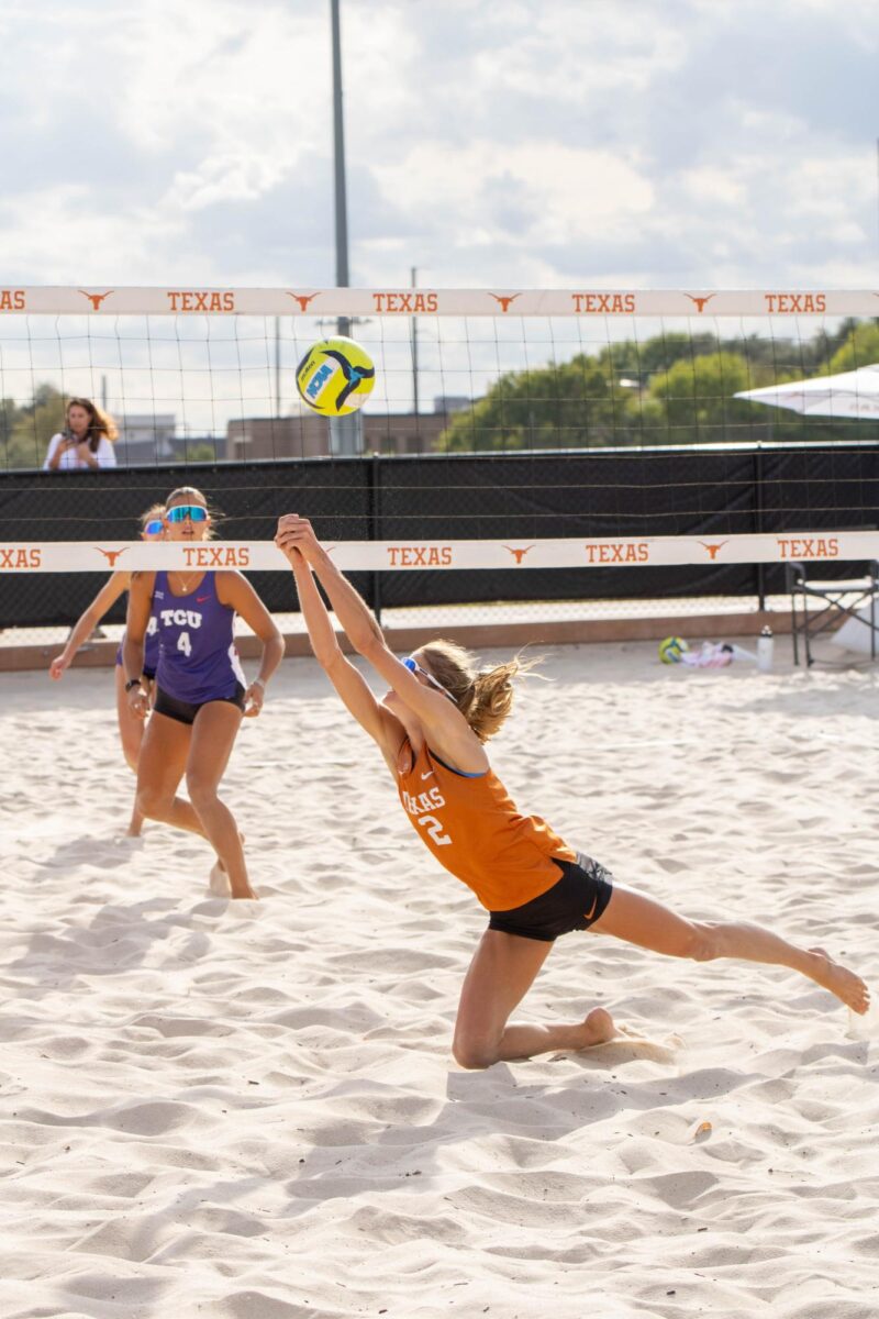 Texas’ Ava Patton dives to save the ball during the team’s match against TCU at the Whitaker Sports Complex on Friday, Oct. 24, 2025. The match was part of a two-day event marking the Longhorns’ first home appearance of the fall.