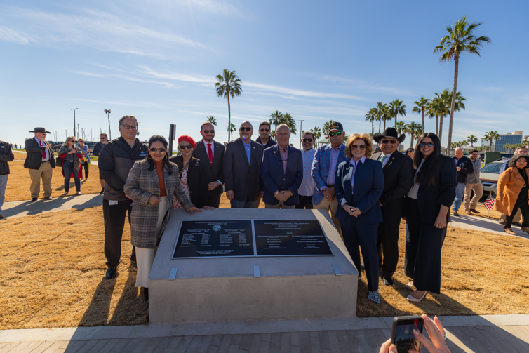 A photo of elected officials dedicating two plaques for the helicopter monument at Sherrill Veterans Memorial Park