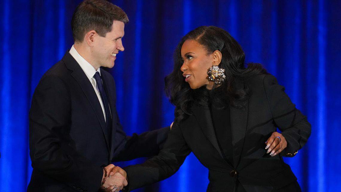 State Rep. James Talarico, left, and U.S. Rep. Jasmine Crockett, Democratic primary candidates for U.S. Senate, shake hands prior to a debate at the Texas AFL-CIO COPE Convention in Georgetown, Texas,  on Jan. 24, 2026.