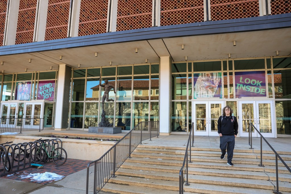 Carter walks down the steps outside the library on the Texas Tech campus in Lubbock on Jan. 29, 2025.