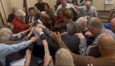 U.S. Rep. Wesley Hunt, who is running for a senate seat in the 2026 midterm elections, prayed with voters at an event in Denton Feb. 18.