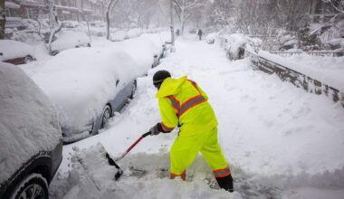 People shovel snow in the streets of Brooklyn as blizzard conditions continue on Monday, Feb. 23, 2026, in New York City. New York City Mayor Zohran Mamdani announced a state of emergency yesterday for New York City and issued a travel ban until 12 p.m. on Monday. New York City is expecting well over a foot of snow in what has become one of the largest winter storms in the city's history.