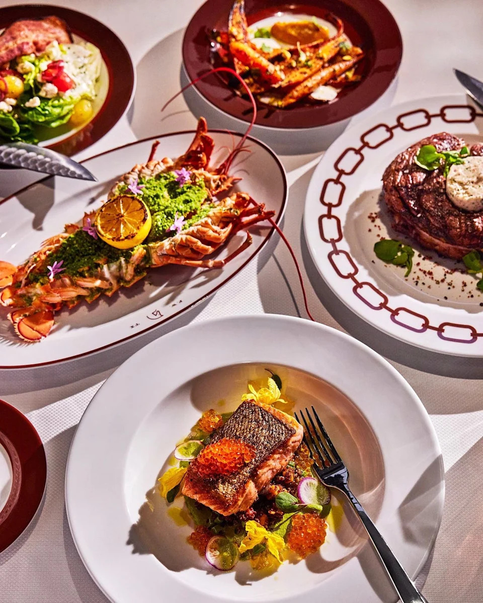 an elaborate spread of gourmet dishes featuring seafood and meat