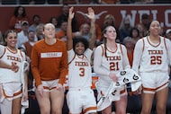 Texas guard Rori Harmon (3) and teammates reacts to a play during the second half of an NCAA...