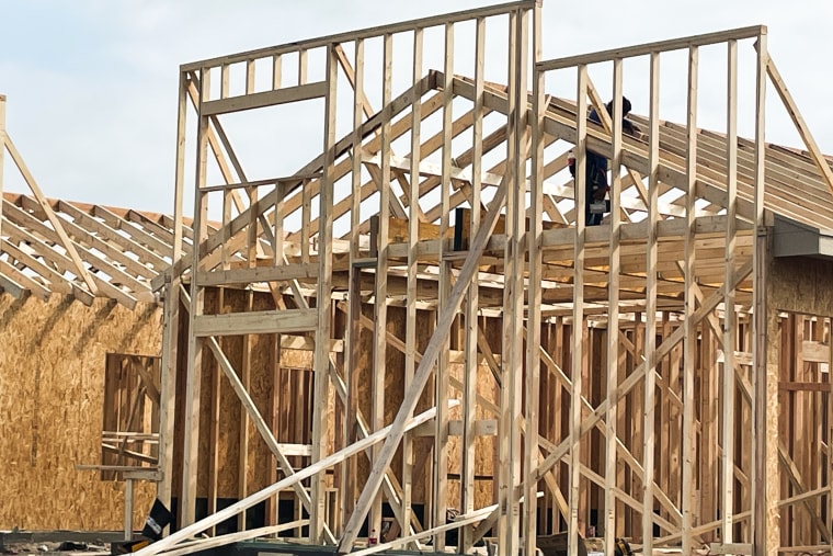 A laborer builds the frame of what will be an apartment complex. Home builders in the Rio Grande Valley say they are having trouble finding workers because of immigration enforcement raids. 