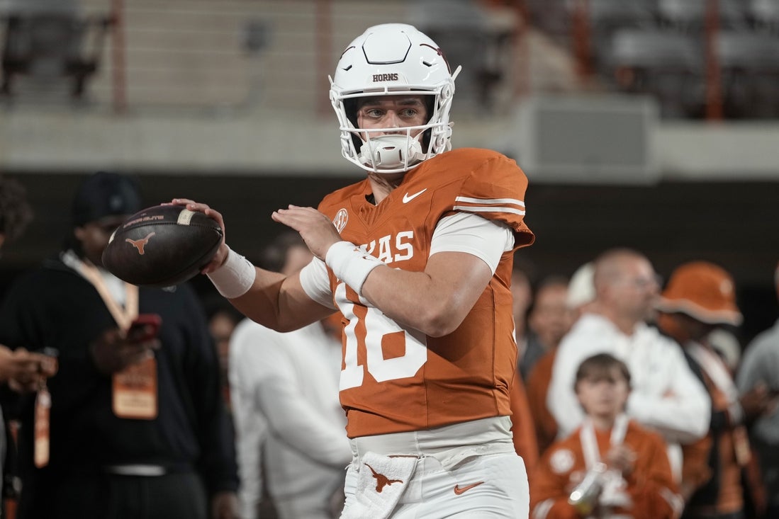 Nov 28, 2025; Austin, Texas, USA; Texas Longhorns quarterback Arch Manning warms up before a game against the Texas A&M Aggies at Darrell K Royal-Texas Memorial Stadium. Mandatory Credit: Scott Wachter-Imagn Images
