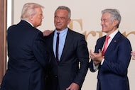President Donald Trump greets Health and Human Services Secretary Robert F. Kennedy Jr. and...