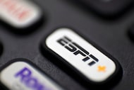FILE — This Aug. 13, 2020 file photo shows a logo for ESPN on a remote control, in Portland,...