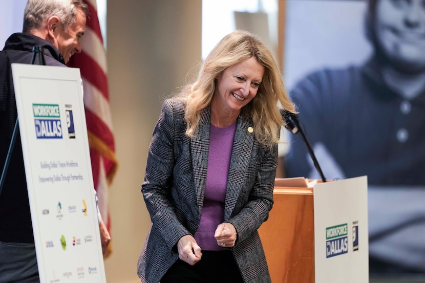 Lynn McBee, workforce development czar for the city of Dallas, trades the podium with Tim...