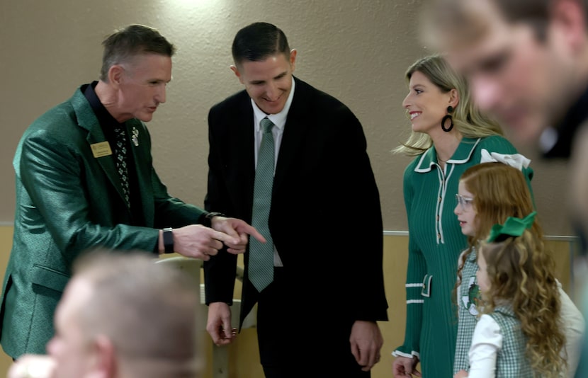 Carroll ISD School Board President Cameron Bryan, left, greets Lee Munn, his wife and...