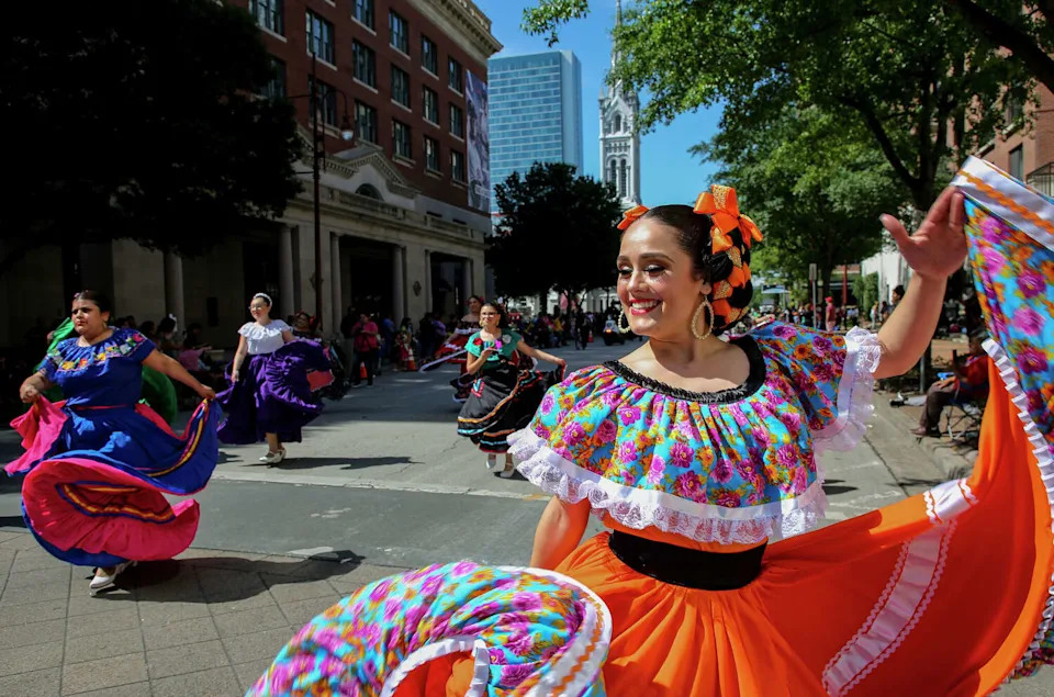 Melissa Lopez and other members of the Danzas Folkloricas de Solei dance group perform during the Cinco de Mayo Parade. (Godofredo A. Vásquez/Staff photographer)