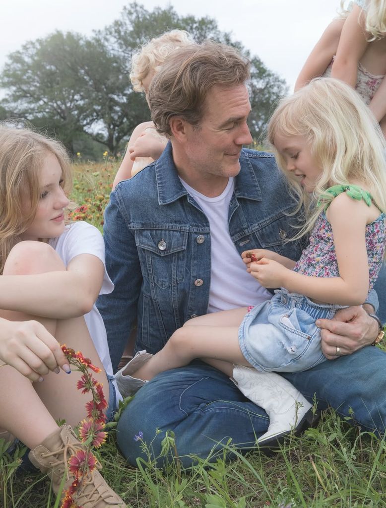 James Van Der Beek and his children chat on the grass