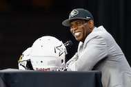 Colorado head coach Deion Sanders smiles during his press conference at Big 12 Media Days at...