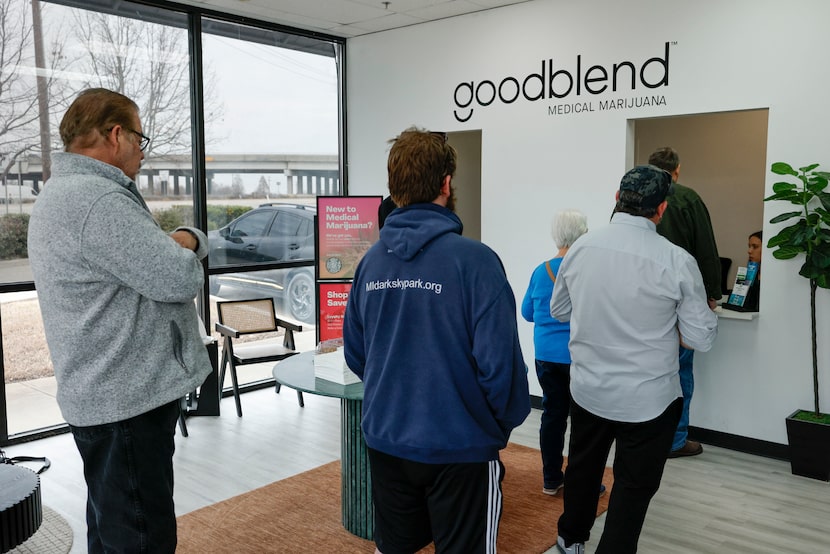 Customers wait in line to purchase medical marijuana at Goodblend medical marijuana...