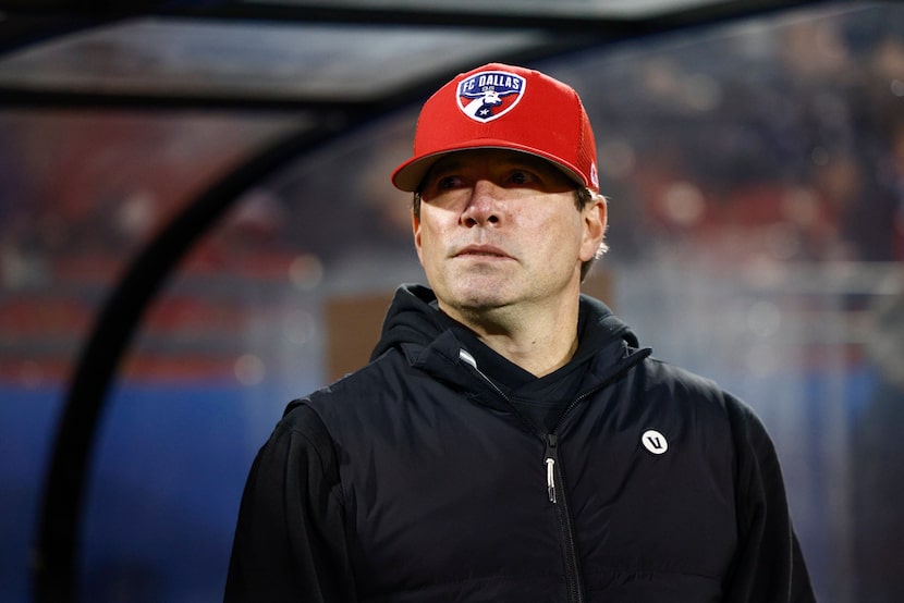 FC Dallas head coach Eric Quill stands near the bench before the first half of an MLS game...