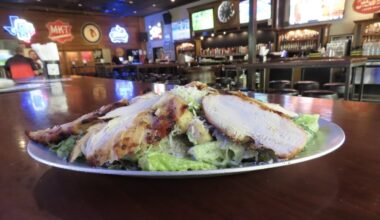 a chicken cesar salad on a plate