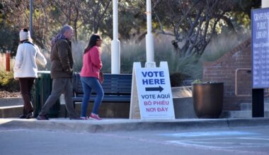 people walking into library