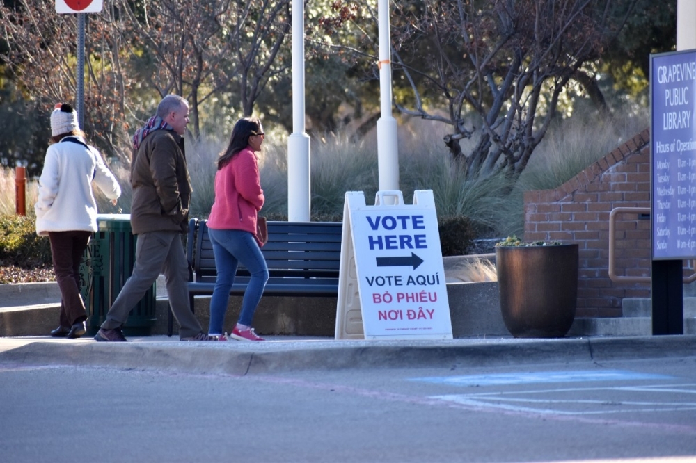 people walking into library