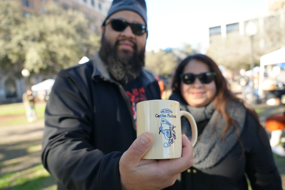 People holding a coffee mug