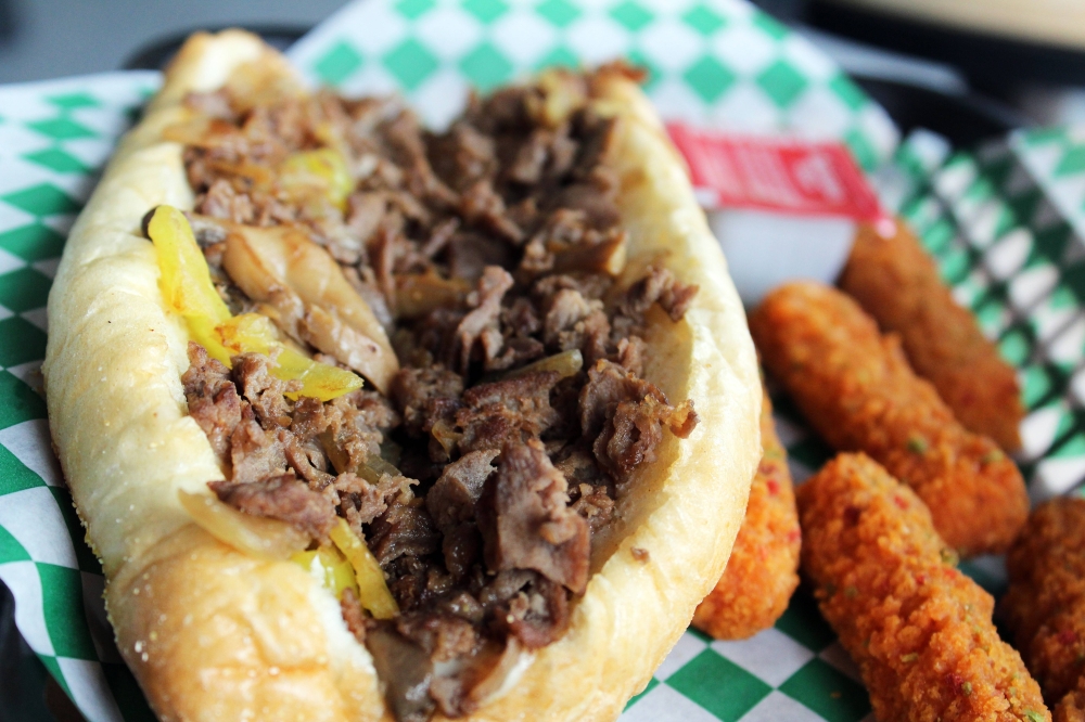 Big Tony’s mushroom cheesesteak ($9.40) features steak, sauteed onions, mushrooms and cheese. Also pictured are spicy mozzarella cheese sticks ($6.75). (Karen Chaney/Community Impact)
