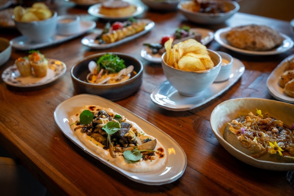 Spread of food offerings from Roya on a table