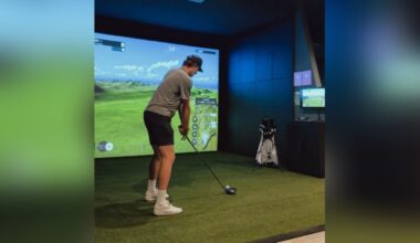 Image of a person teeing off at Tour Studio Golf