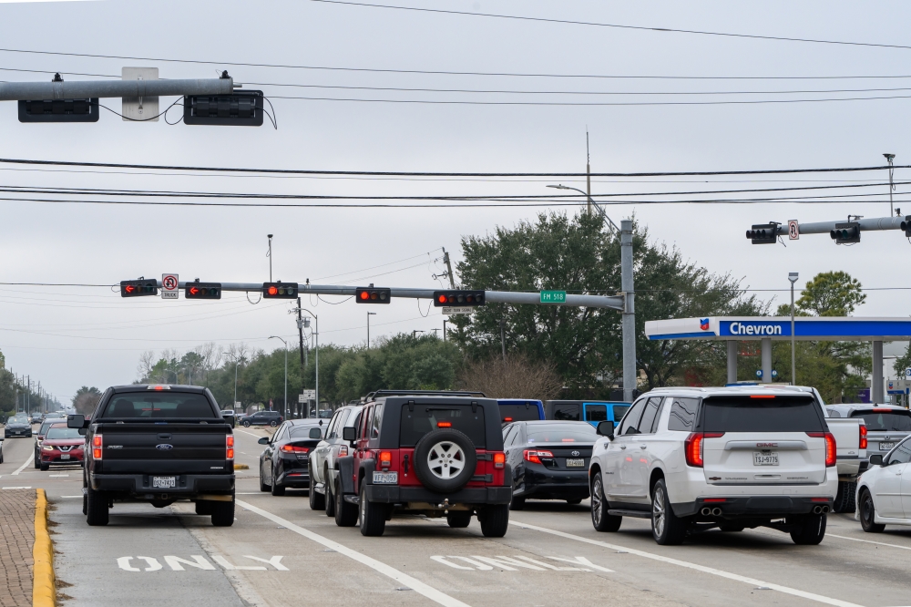 Drivers wait in traffic on the East Broadway Street and Dixie Farm Road intersection, which is included in Pearland's ongoing traffic signal upgrade program. (Jamaal Ellis/Community Impact)