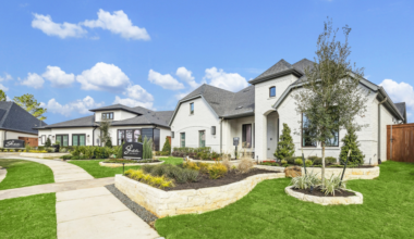 Front view of a Shea Homes Wildtree home in Magnolia Texas with spacious driveway, landscaped garden, and nature-focused community amenities
