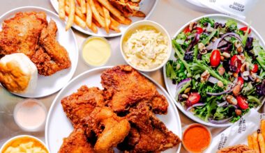 Overview of a variety of dishes filled with fried chicken and sides.