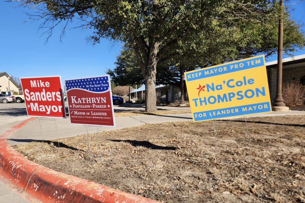 Campaign signs stood outside Leander City Hall ahead of the Feb. 7 special election. (Daniel Schwalm/Community Impact)
