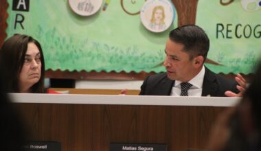 The superintendent talks at a board meeting