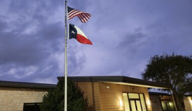 The American and Texas flags fly outside Pat Bryson Municipal Hall, which houses the Leander City Council chambers.