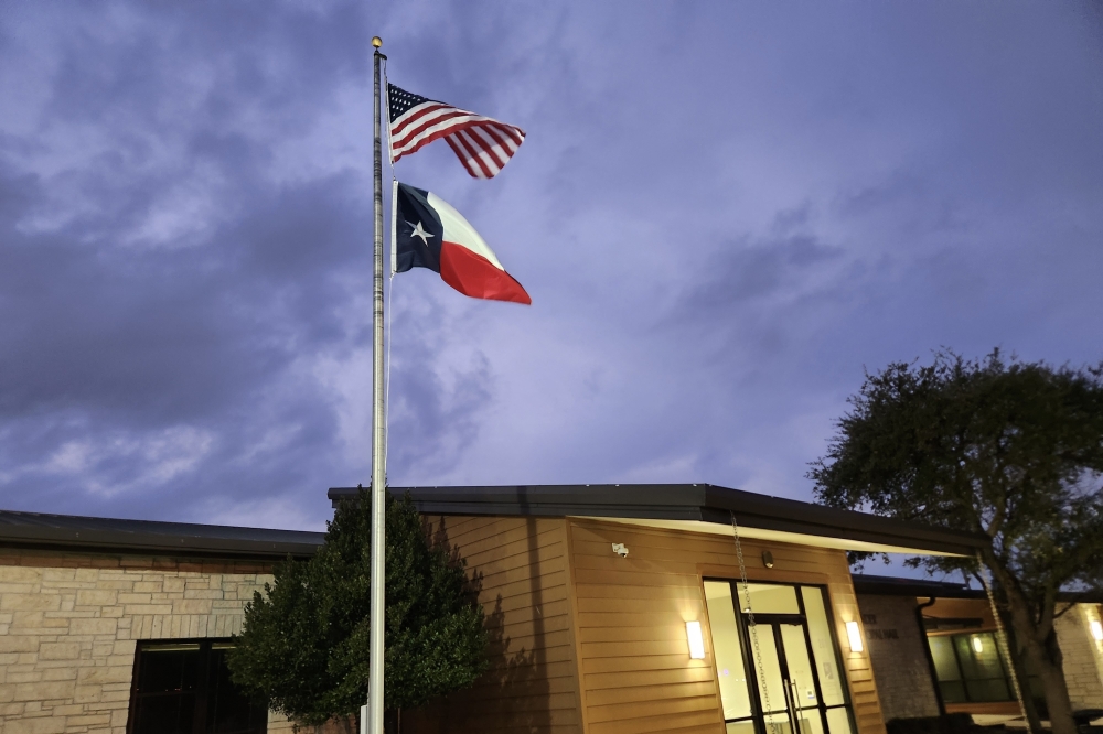 The American and Texas flags fly outside Pat Bryson Municipal Hall, which houses the Leander City Council chambers.