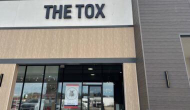 Exterior of a strip center featuring The Tox signage.