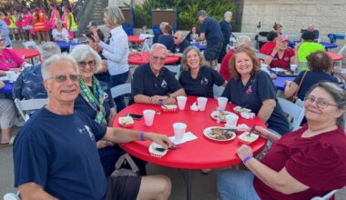 Members of the Allen ISD Silver Eagles Club smile for a photo taken during a Silver Eagles Tailgate event held Oct. 17, 2025.