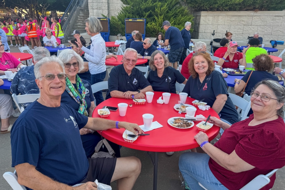 Members of the Allen ISD Silver Eagles Club smile for a photo taken during a Silver Eagles Tailgate event held Oct. 17, 2025.