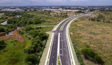 Aerial photo of Marketplace Avenue with green fields on both sides.