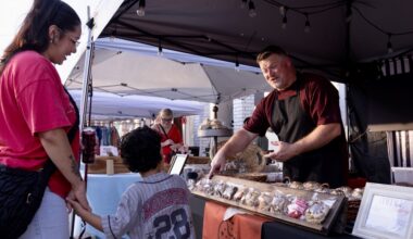 Strahan’s Bakehouse owner recommending a cookie to a young patron and his mom.