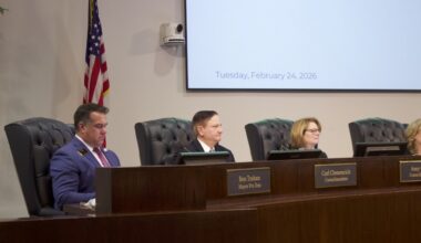 council members sitting at a dais for a meeting