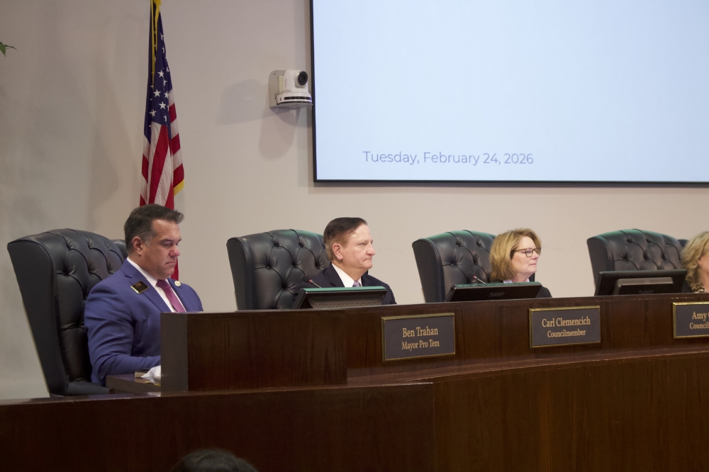 council members sitting at a dais for a meeting