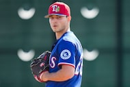Texas Rangers pitcher Jack Leiter participates in a fielding drill during a spring training...