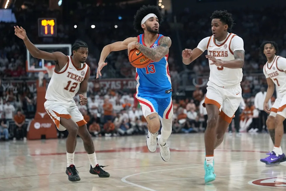 AUSTIN, TEXAS – FEBRUARY 7: Kezza Giffa #13 of the Ole Miss Rebels drives to the basket between Tramon Mark #12 and Dailyn Swain #3 of the Texas Longhorns during the second half at Moody Center on February 7, 2026 in Austin, Texas. (Photo by Scott Wachter/Getty Images)