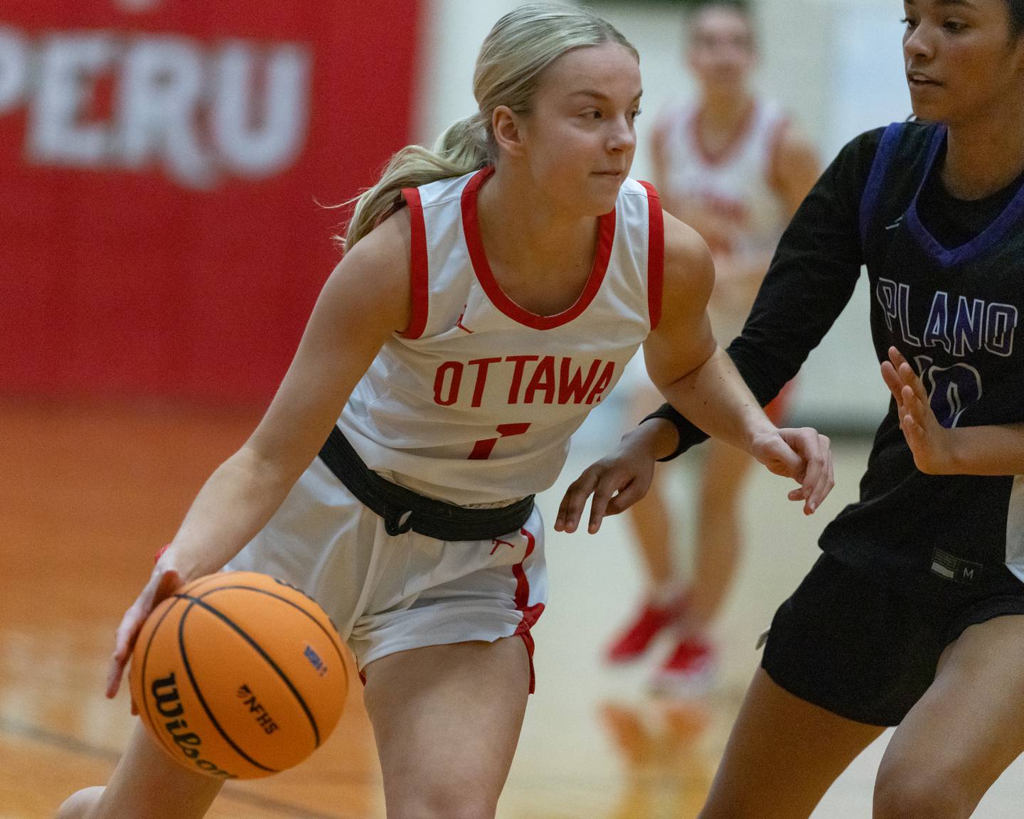 Ottawa's Lila Platt tries to dribble closer to the basket against Plano High School during the IHSA Class 3A Girls Basketball Regionals in Sellett Gym on February 16, 2026 at LaSalle-Peru High School.