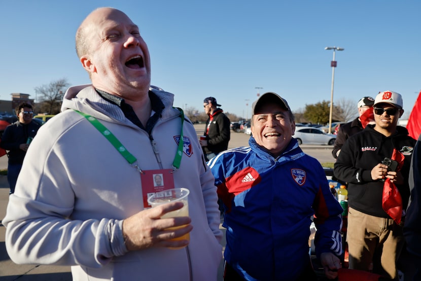 FC Dallas President Dan Hunt (left) laughs along with Ciro Martinez as he joined members of...