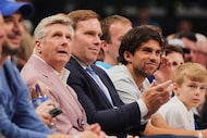 Dallas Mavericks CEO Rick Welts, center left, and team Governor Patrick Dumont, center right...