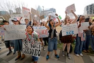 Students protest the federal immigration crackdown at Klyde Warren Park during a walkout of...
